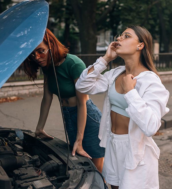 two-women-with-broken-car-on-the-road-open-hood-600