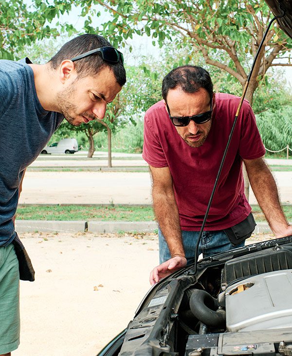 young-men-with-a-problem-with-the-engine-of-a-car
